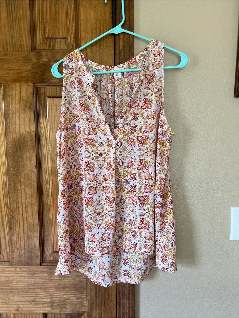 Artisan Ny Floral Sleeveless V-Neck Sleeveless Blouse in White, Red, and Mustard
